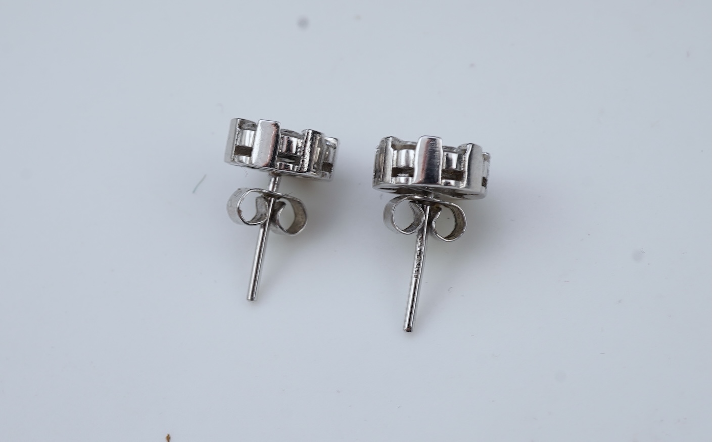 A pair of diamond stud earrings